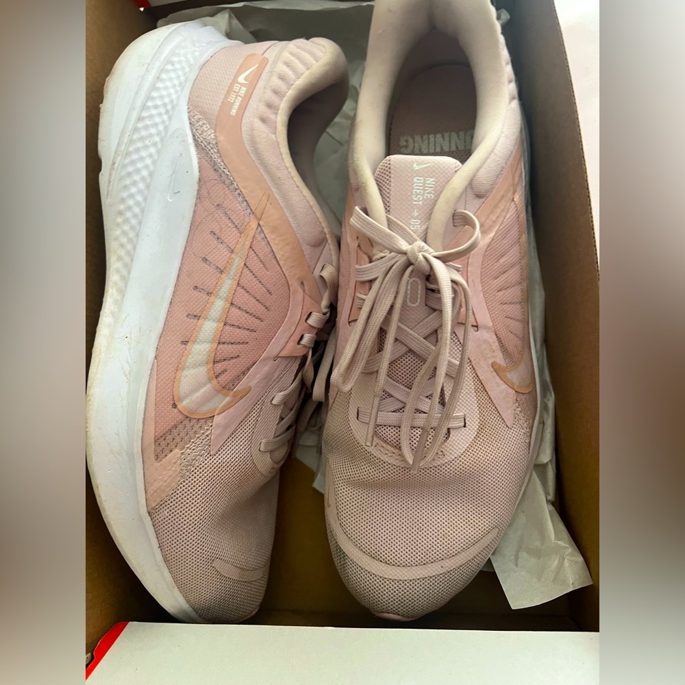 Blush pink Nike running shoes